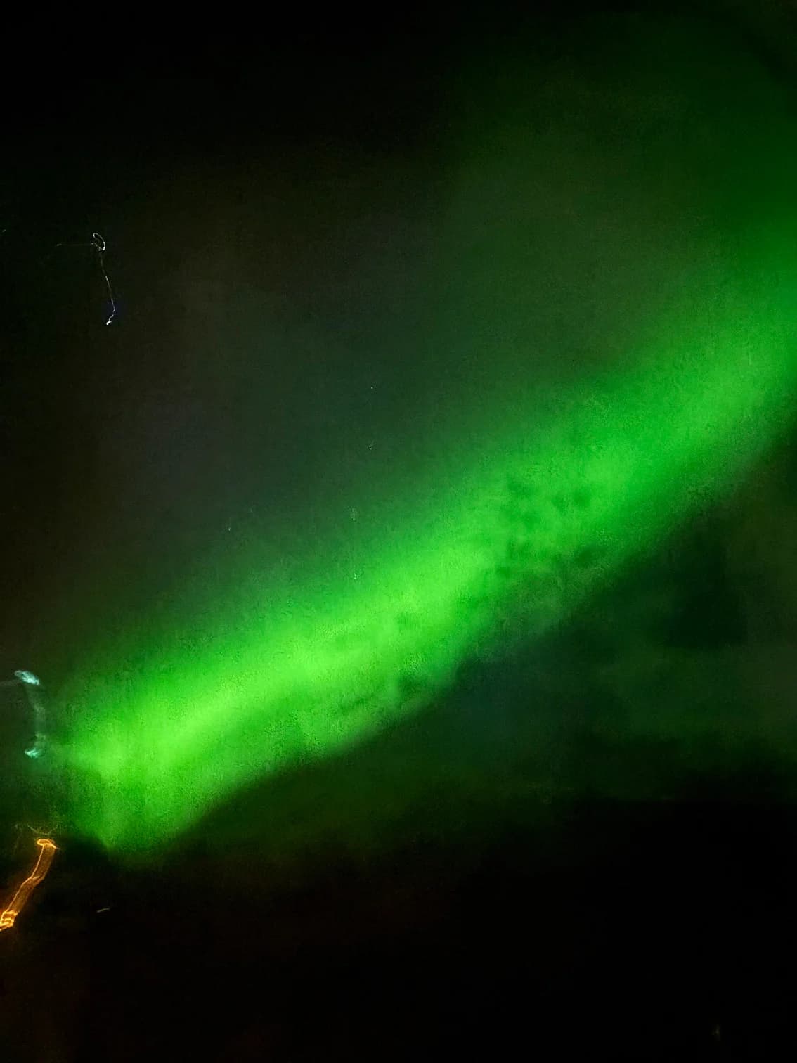 A vivid green aurora across the Icelandic sky