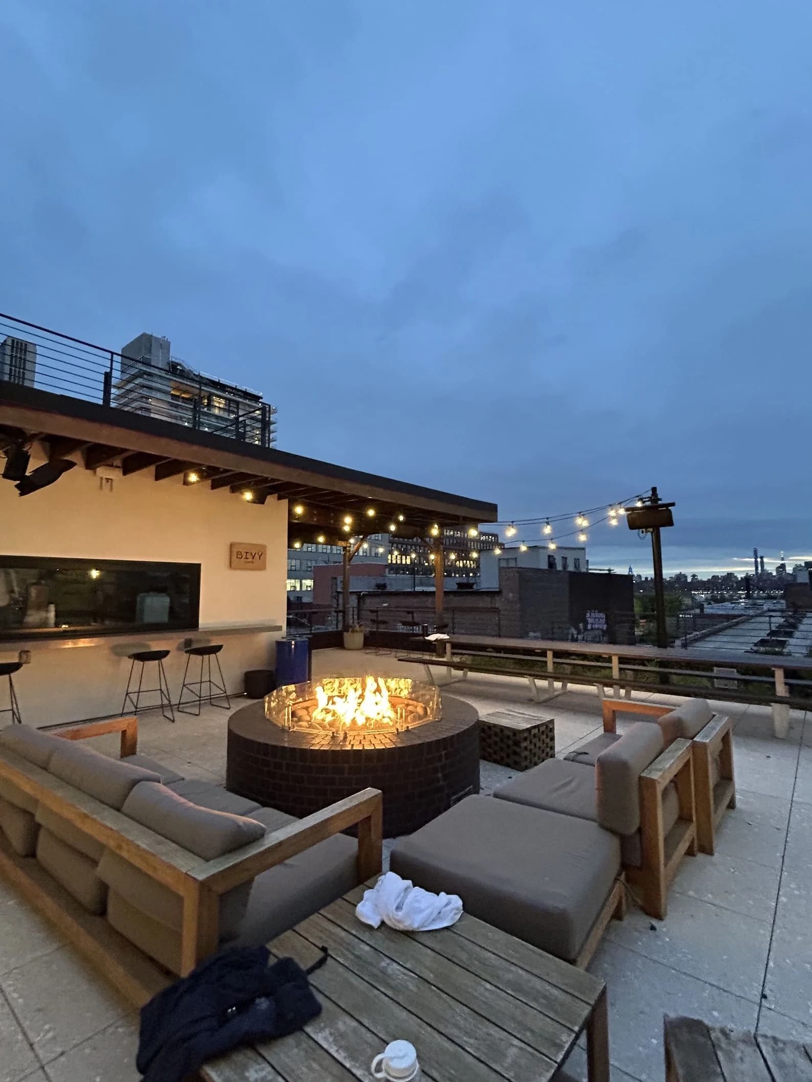 A relaxed Brooklyn rooftop at dusk