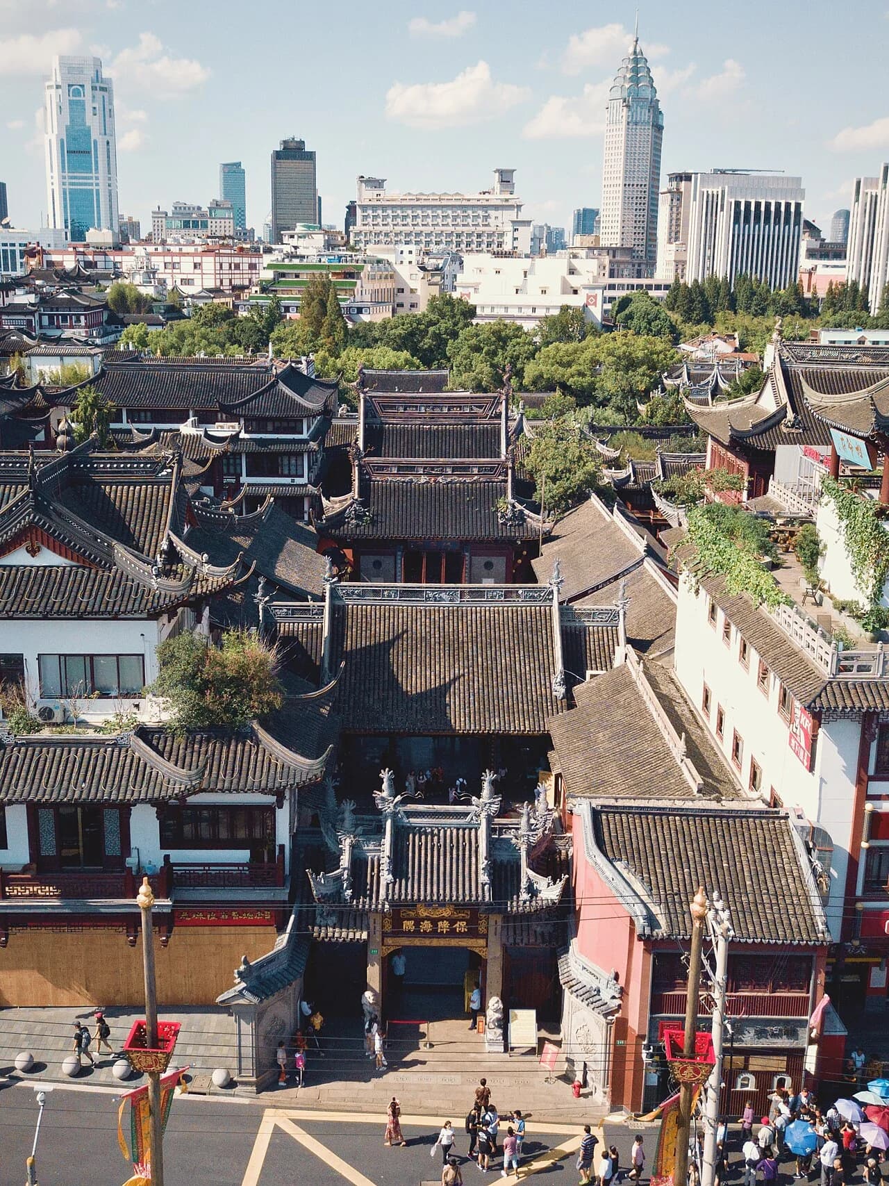 Historic rooftops stretching toward Shanghai’s modern skyline